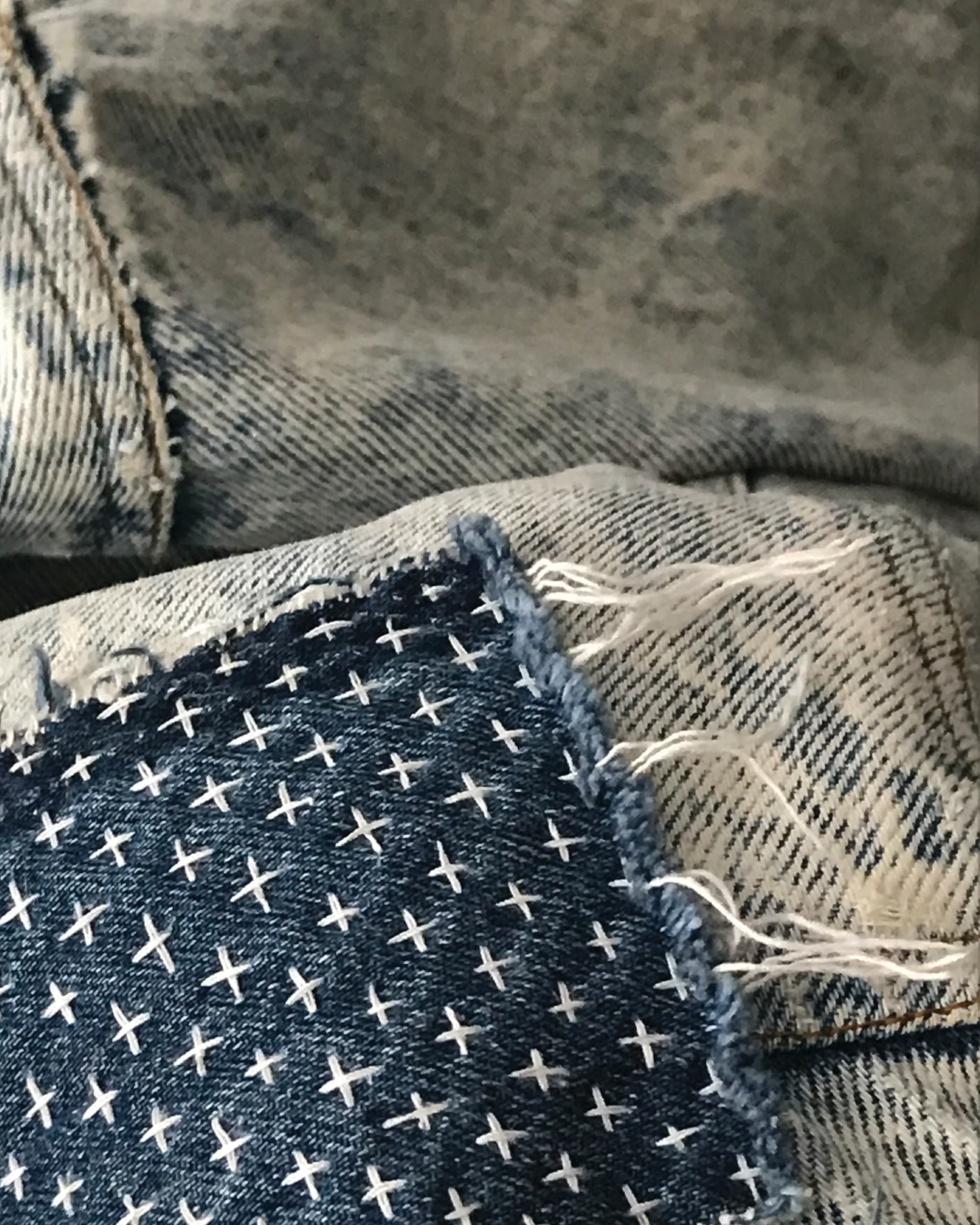 Denim fabric with cross-shaped embroidery
